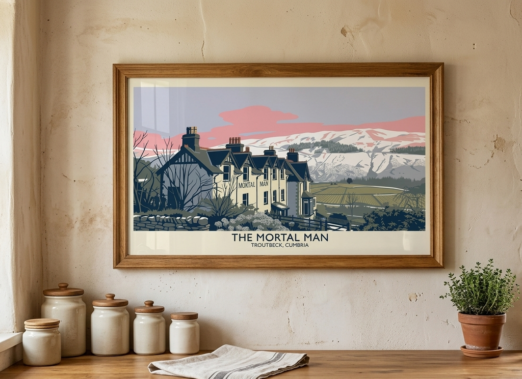 Framed Mortal Man poster displayed on a rustic interior wall featuring the historic Lake District inn at Troutbeck.